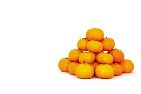 stack of fresh mandarin oranges on white background, copy spaceの写真素材