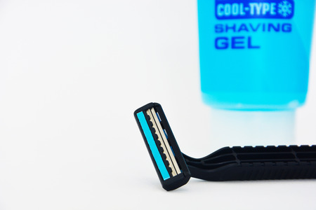 black shaving razor and shaving gel isolated on white background, copy spaceの写真素材