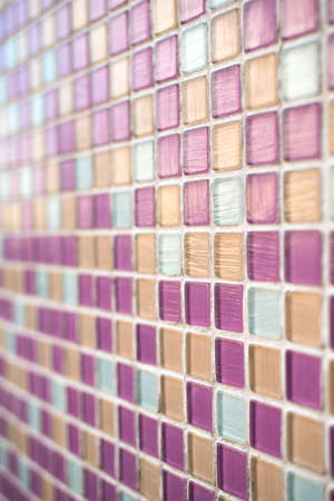 Closeup of pink swimming pool tiles