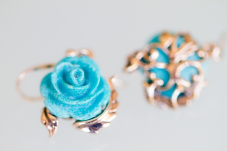 Sterling Silver Fish Wire Earring with Carved Rose Stabilized Turquoiseの写真素材