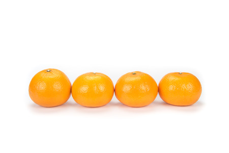 oranges arranged to symbolize teamwork or unity isolated on white backgroundの写真素材