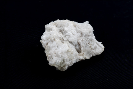 rare white quartz crystals stone on black background