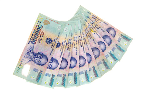 Vietnamese currency dong banknotes arrange in a row isolated on white background