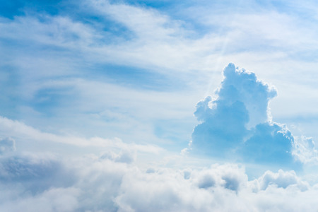 The View from the plane window above the cloud and blue sky