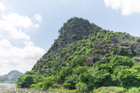 Little small slope mountain on a day with clear skyの写真素材
