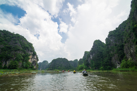 Tam Coc, Ninh Binh, Vietnam - September 14, 2014. Tour tourist boats in bayのeditorial素材