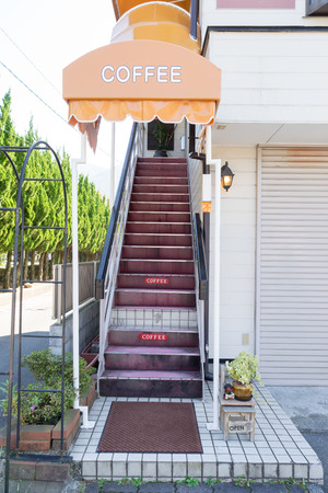 Stairway to the coffee shop on second floor with a colorful canopyの写真素材