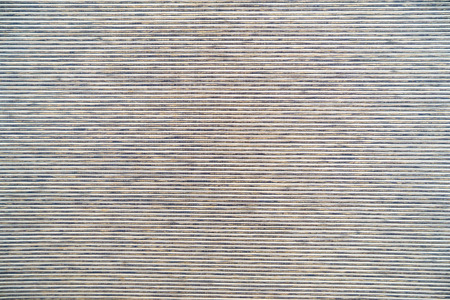 Knitted fabrics in front of wood texture backgroundの写真素材