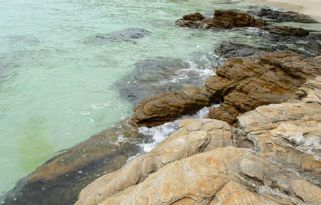 sea wave and thr rock at samed island, Thailandの写真素材