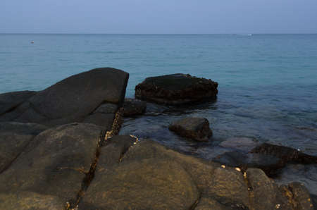 the rock and sea in the evening time at samed island, Thailandの写真素材