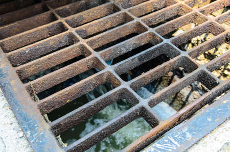 sewage in the public water drain on the street