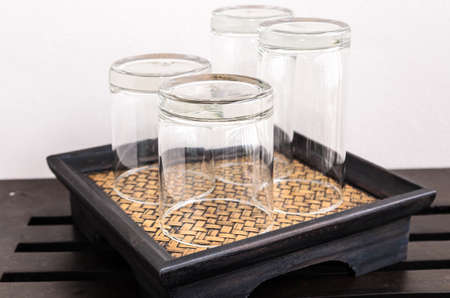 4 glasses on the woven coasterの写真素材