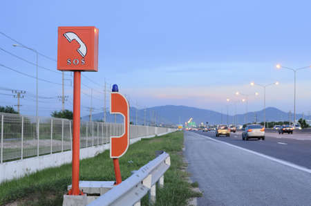 emergency telephone on highway in the evening timeの写真素材