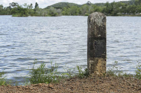 stone pole prevent accident from Laterite roadの写真素材
