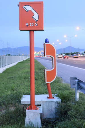 emergency telephone on highway in the evening timeの写真素材