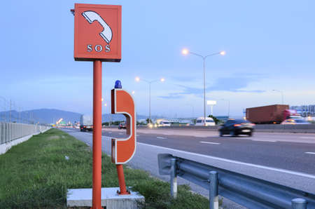 emergency telephone on highway in the evening timeの写真素材