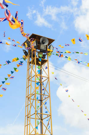 the public loudspeaker in THAILAND decorate with flag of THAILAND and buddhismの写真素材