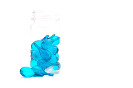 hair vitamin serum capsule in the bottle on the isolated background