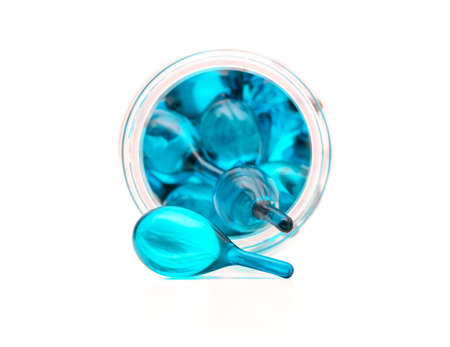 blue hair vitamin serum capsule in the bottleの写真素材