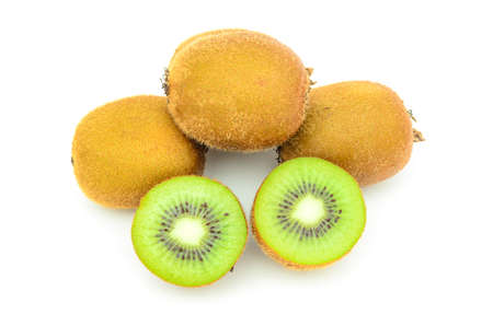 whole and half kiwi fruit segments isolated on white の写真素材