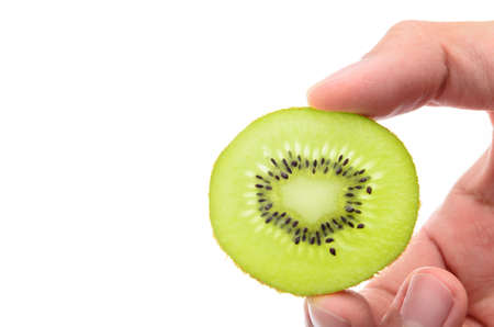 handful sliced kiwi isolated on whiteの写真素材