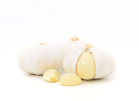 peel garlic isolated on whiteの写真素材