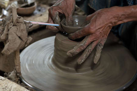 hand working earthenware on  pottery wheelの写真素材