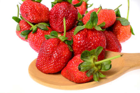 strawberries put on wodden spoonの写真素材