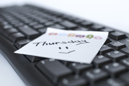 days of the week written marker on the sticker are on the keyboard.の写真素材