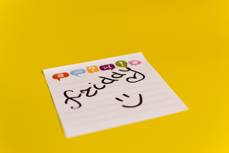 inscription in black marker on Friday on a white sticker yellow backgroundの写真素材