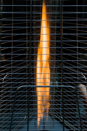 gas burner in a steel cage for heating the premises of outdoor cafes in winter. winter garden,...