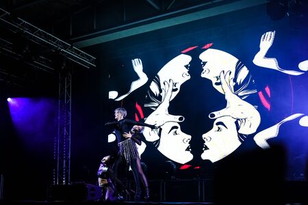 cheering crowd at a concert, show neon people sceneのeditorial素材