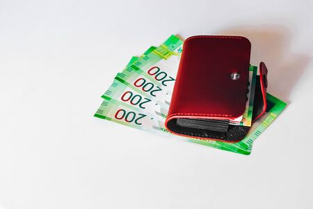 brown leather wallet with plastic cards and Bank of Russia banknotes. Russian money for 200 rubles.の写真素材