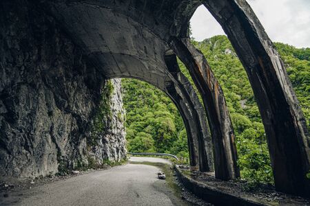 old tunnel. abandoned mountain road Russia Sochi Krasnaya Polyanaの写真素材