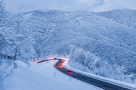 Mountain Road Winter Landscape Snow Path Automobile roadの写真素材