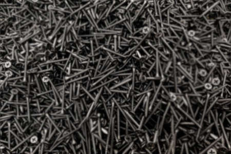 Self-Tapping Screw Black Steel Lot Pile Construction Shop Background Blurredの写真素材