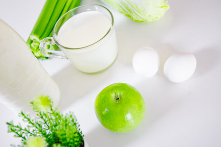 set of products for healthy eating white and green layout on the kitchen table.の写真素材