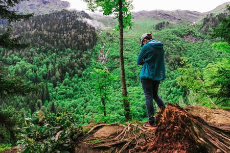 thoughtful man against the background of a young nature reviving after winter. unityのeditorial素材