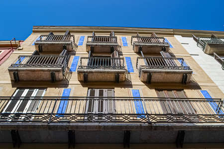 view from the street on the walls of old different buildings windows balconies of Europe.のeditorial素材
