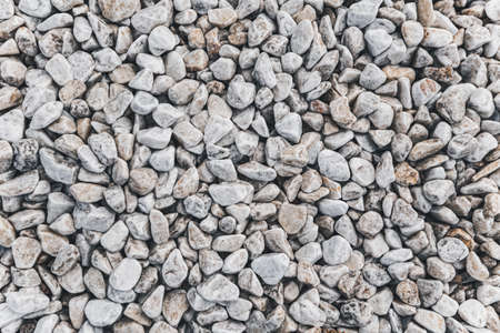 Clean White Pebbles texture. Small stones on the ground. Top view. backdropの写真素材