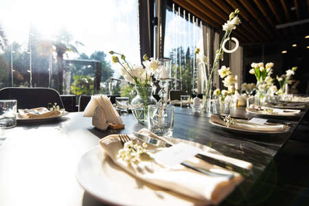 Table set for holiday, event, party or wedding reception in a restaurantの写真素材