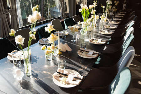 Table set for holiday, event, party or wedding reception in a restaurantの写真素材