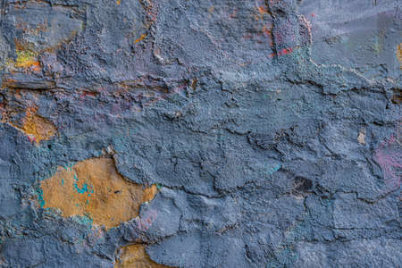 crack in the plaster walls of the old building close-up.