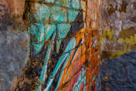 Old brick wall background, brick wall texture, structure. old broken brick, cement joints, close-up. crumbling from old age. construction, repair. concept of devastation, decline.の写真素材