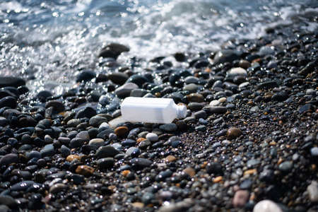 beach pollution. Plastic bottles trash on sea beach. Garbage on the beach. plastic at the ocean.