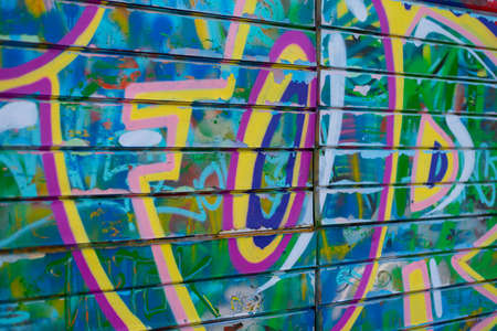 Graffiti bright colored old plastered. Closeup of colorful messy painted urban wall texture. Modern patternの写真素材