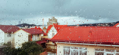 Raindrops on the window. outside the window streetscape.の写真素材