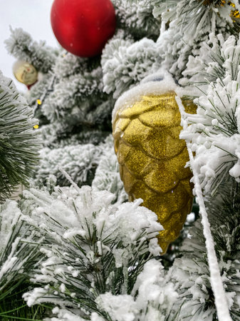 yellow cone christmas tree toy for christmas in the snowの写真素材