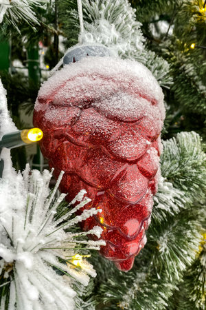 red cone christmas tree toy for christmas in the snowの写真素材