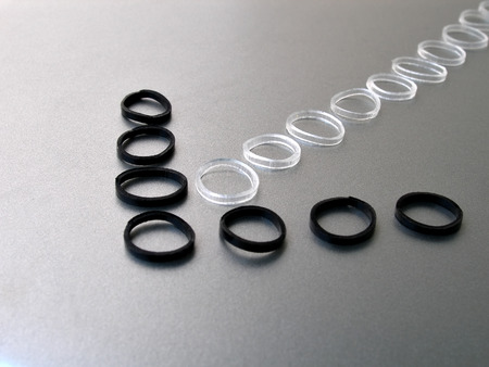 Black and white rubber bands arranged in an arrow patternの写真素材